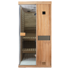 Samsora 701ST indoor sauna front presentation - African mahogany single-person model with glass door, polished hardware and therapeutic red light ambiance