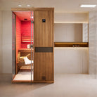 Samsora 702ST indoor steam sauna lifestyle scene - premium mahogany wood sauna in elegant home interior with warm ambient lighting