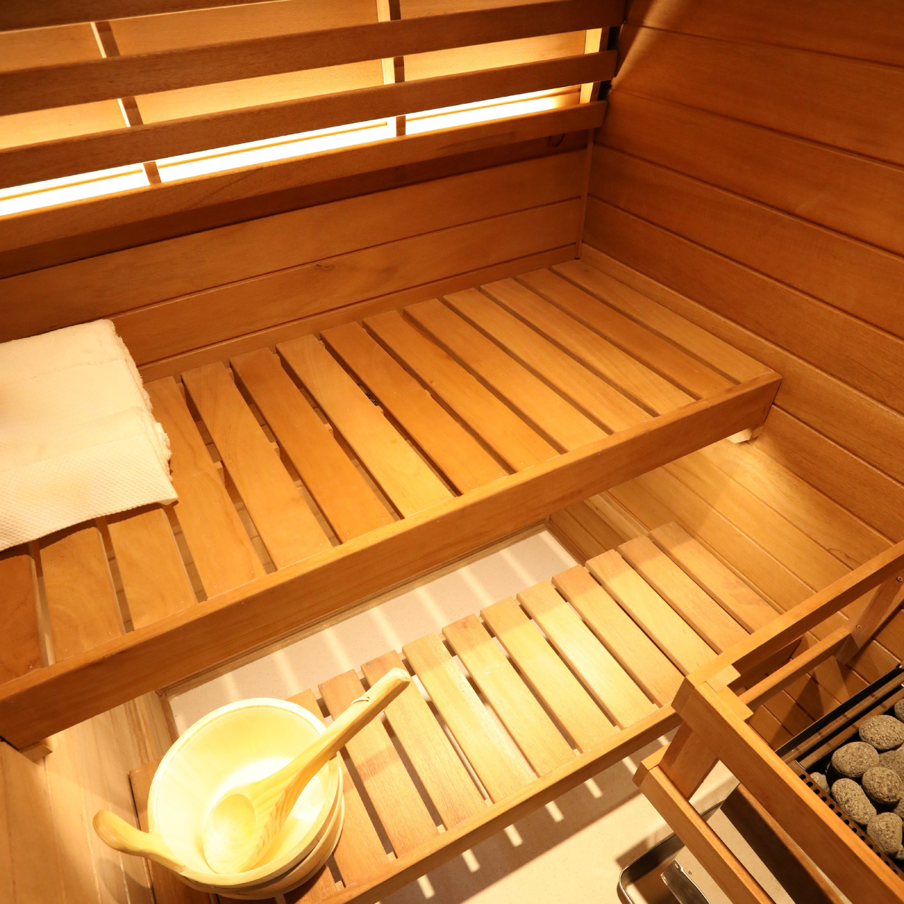 Samsora 702VT interior detail showcase - African mahogany two-person sauna featuring dual bench seating, 660nm red light therapy panels and negative ion wellness technology