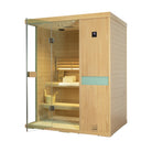 Samsora 703SH indoor steam sauna oblique view - angled presentation demonstrating hemlock panel continuity, glass door clarity and spatial presence