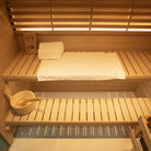 Samsora 703SH steam sauna interior close-up - detailed view of hemlock wood grain, ergonomic seating and precision craftsmanship