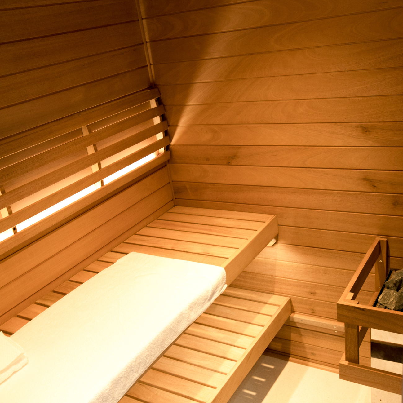 Samsora 703ST indoor steam sauna interior with African mahogany wood - premium natural wood finish and spacious cabin design