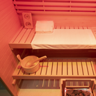 Samsora 704SH interior wellness display - Canadian hemlock craftsmanship featuring therapeutic 660nm red light panels, spacious four-person bench seating and negative ion air 
