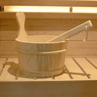 Wooden sauna bucket display - natural wood construction with metal bands for water storage and essential oil infusion during steam sessions